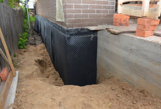 Happy homeowners after waterproofing job in Parrish
